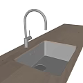 Stainless Steel Kitchen Sink With Faucet On Light Colored Modern Countertop