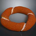 Golden Brown Ring Shaped Pastry With Textured Surface And White Cream Filling