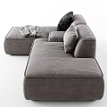 Modern Gray Sectional Sofa With Black Pillows And Draped Soft Blanket 3d model
