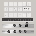 Different Types of Electrical Switches and Sockets in White and Metallic Finishes Arranged on Wall