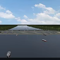 Scenic Bridge Over River With Boats Green Banks And Blue Sky