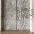 Gray Stone Textured Background Wall With Potted Green Plant And Herringbone Wooden Floor