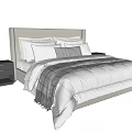 Double Bed with Striped Comforter Pillows and Wooden Nightstands Design