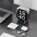 Sleek Laptop On Black Desk With Headphones Notebooks Smartphone Clock And Mouse