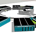 Modern Office Building With Curved Glass Facade And Blue Accent Structure