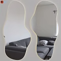 Modern Lighted Wavy Mirror Reflecting Gray Sofa In Living Room