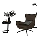 Brown Armchair With Black Side Table Vase Plants And Floor Lamp
