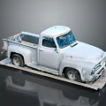Vintage White Pickup Truck Displayed On Platform With Weathered Exterior Details