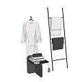 Bathroom Accessories Featuring Grey Bathrobe On Wooden Hanger And Textured Towels On Black Metal Rack