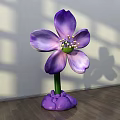 Floral Art Installation with Purple Petals Yellow Stamen and Green Stem in Interior