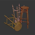 Natural Wooden Stools With Round Seats And Slender Legs In Standing And Fallen Positions