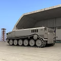 Large Tracked Utility Vehicle with Overland 1001 Marking Parked in Hangar Area
