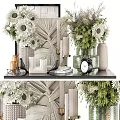 Elegant Ceramic Vessels Display With Green Plants White Flowers And Decorative Clock On Shelf