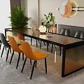 Modern Dining Table Set With Glass Top Black Orange Chairs And Potted Plant