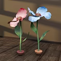 Floral Decoration With Two Large Pink White Blue Flowers Green Stems Leaves In Brown Pots