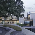 Modern Commercial Street Architecture With White Roofs Lush Trees And Green Spaces
