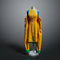 Stylish Yellow Dress With Blue Shoulder Details And Green Cuffs Displayed On Mannequin
