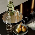 Transparent Glass Tea Set On Silver Tray With Green Bottle Pastries And Magazine