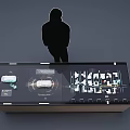 Modern Exhibition Display Table With Various Exhibits And Human Silhouette 3d model