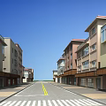 Modern Commercial Street With Spacious Road Yellow Lines Zebra Crossing And Buildings On Both Sides