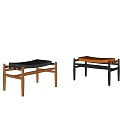Minimalist Sofa Stools With Wooden Frame And Black Brown Cushions On Light Background