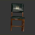 Classic Green Leather Chair With Wooden Frame And Golden Emblem On Backrest