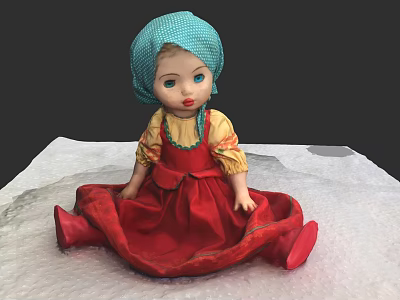 Traditional Doll With Blue Turban Yellow Blouse And Red Dress Sitting On White Surface 3d model