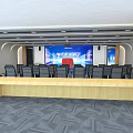 Modern Conference Room Interior Design With Large Screen Chairs And Wooden Long Table