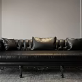 Luxury Black Leather Multi Person Sofa With Tufted Back Carved Legs And Decorative Pillows