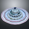 Circular Outdoor Fountain With Multi tiered Stone Structure And Pink Border