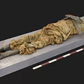 Ancient Skeleton Remains Wrapped in Aged Cloth With One Meter Measurement Scale