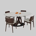 Modern Round Dining Table And Chairs Set With White Tabletop Crossed Legs And Orange Fruits