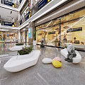 Modern Shopping Mall Lobby Interior With Glass Storefronts White Seating Green Plants And Displays