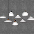 Multiple Modern White Chandeliers With Gold Accents Hanging In Stylish Design