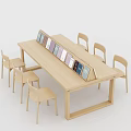 Modern Light Wood Dining Table Set With Six Chairs And Colorful Books
