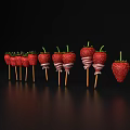 Fresh Strawberries on Wooden Sticks with White Stripes Against Black Background