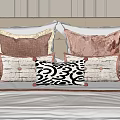 Modern Style Velvet Pillows With Pink Black White Patterns And Tassels On Bed