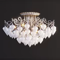 Elegant Chandelier With White Crystal Shades And Ornate Silver Metal Frame