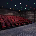 Cinema Interior With Red Seats Dark Walls And Colorful Ceiling Lights