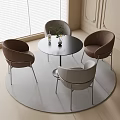 Modern Elegant Round Dining Table With Four Brown Gray Chairs On Rug Near Window Blinds