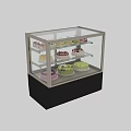 Retail Bakery Display Case With Assorted Cakes And Desserts On Glass Shelves
