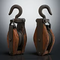 Vintage Metal And Wooden Pulley Pair With Hooks On Dark Surface