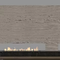 Modern Fireplace With Light Striped Stone Flames Burning And Dark Marble Base On White Wall