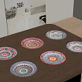 Six Decorative Vibrant Colorful Patterned Plates Arranged On Wooden Tabletop
