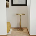 Modern Gold Metal Side Table With Round Top In Bedroom Corner And Yellow Sofa