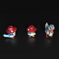 Three Duck Toys With Red Hats And Blue White Gray Colors On Black Background