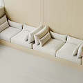 Beige Sofa With Multiple Cushions Against Wall Wooden Frame Light Carpet And Window Blinds