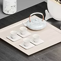 Green Ceramic Tea Set with Teapot Teacups and Square Coasters on Wooden Tray