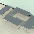Four Gray Stools With Metal Frames And Smooth Seat Surfaces Placed Against Indoor Wall