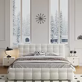 Double Bed with White Headboard Gray Bedding Bedside Lamp Wall Clock and Snowy Trees View